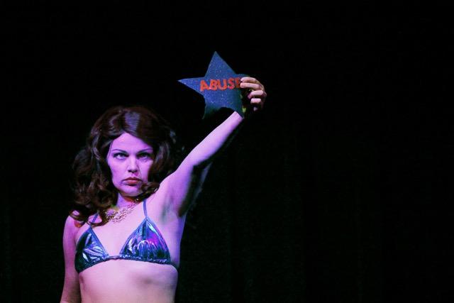 Queen April performs a powerful burlesque piece during “Asheville Vaudeville Gets Political, November 2016